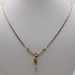  18KT YELLOW GOLD RELIGIOUS FIGURE PENDANT ON ATTACHED CHAIN NECKLACE