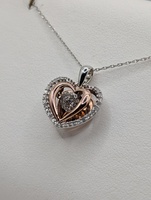  10KT TWO TONE GOLD ~.13 TOTAL CARAT WT. DANCING DIAMOND TRIPLE HEART PENDANT