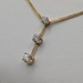  14KT YELLOW GOLD ~.50 TOTAL CARAT WT. THREE-DIAMOND 7/8" LINEAR DROP PENDANT