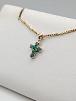  14KT YELLOW GOLD ~.25 TOTAL CARAT WT. ROUND EMERALD 1/2" CROSS PENDANT