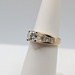  SIZE 5.5 18KT YELLOW GOLD ~.71 CARAT DIAMOND CENTER WITH BRIDGE ACCENT RING